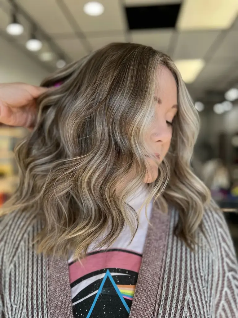 Ash blonde balayage in shoulder-length waves